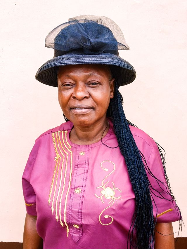 Portrait of Woman in Hat and Pink Clothes