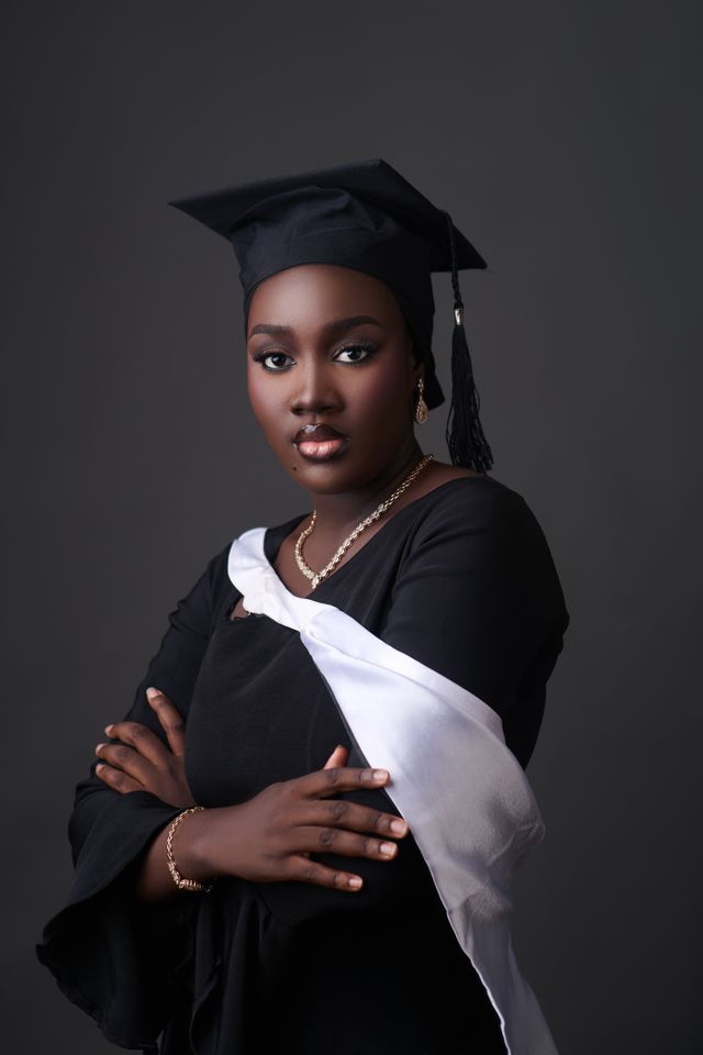 Elegant Nigerian Graduation Portrait with Cap and Gown