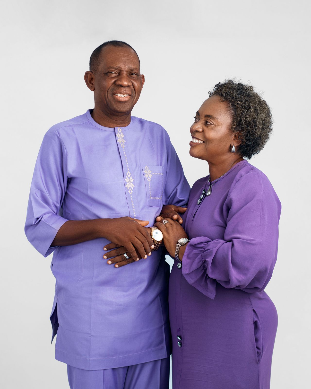 Older couple in matching traditional attire at their anniversary